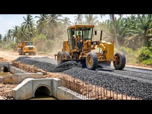 CAT motor grader leveling aggregate base on a road construction site