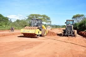 Soil compactor working on a road corridor