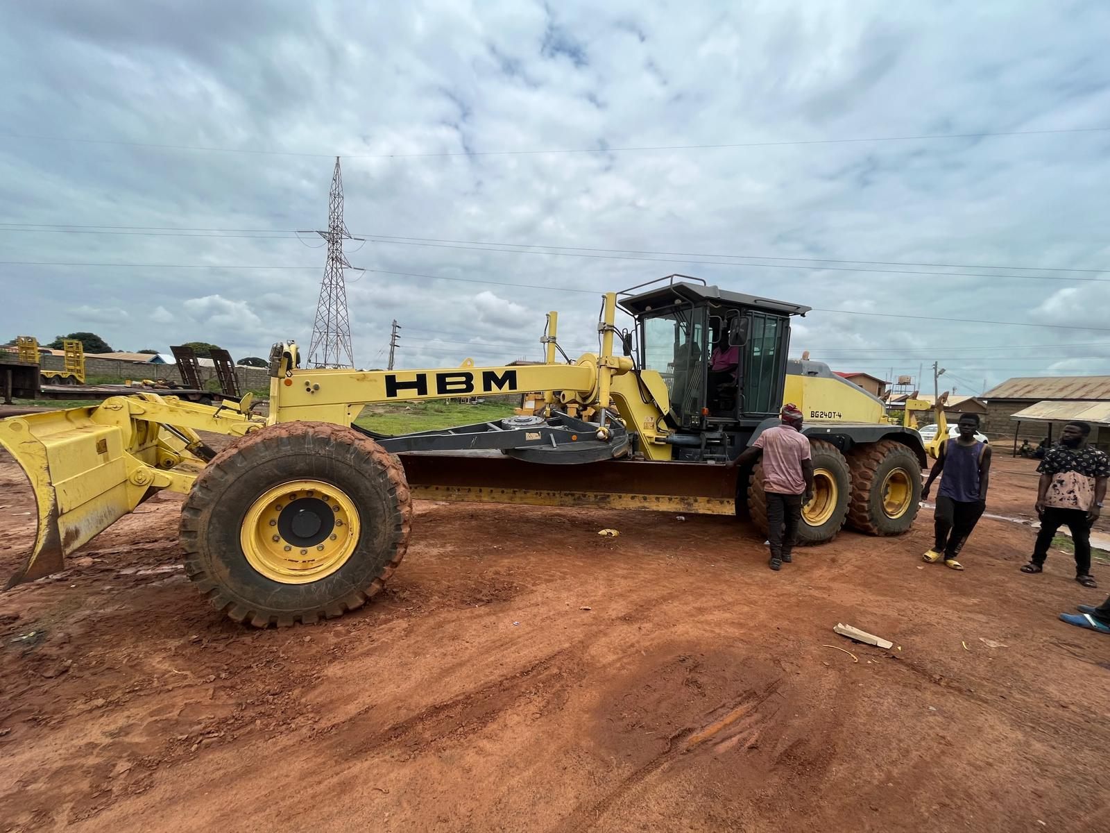 HBM motor grader on site with crew